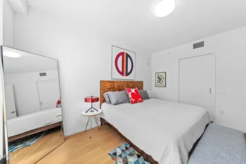 a bedroom with furniture and a window