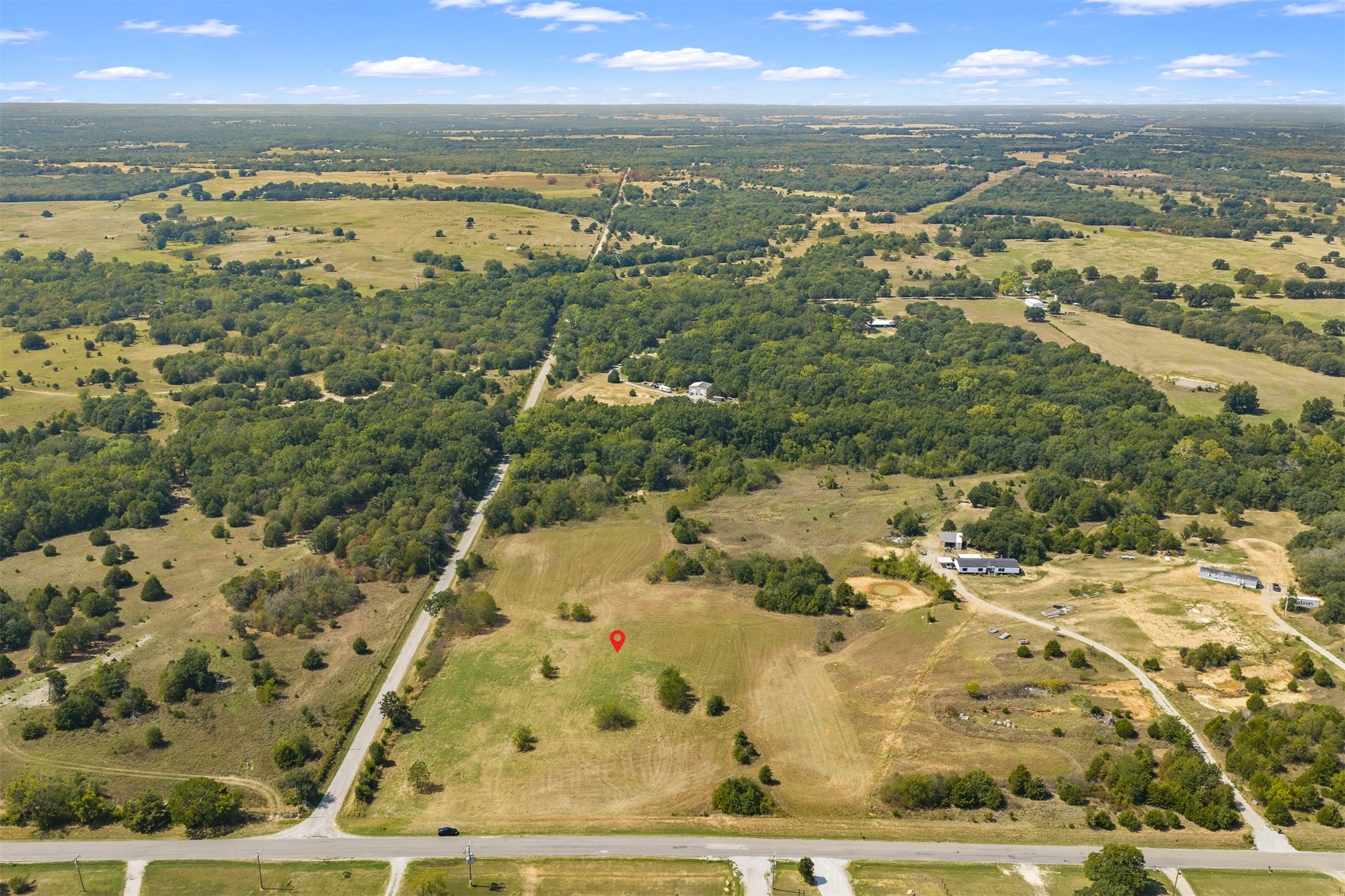 162 Big Bear Road Lone Grove, OK 73443 - Photo 3 of 12 Expansive acreage with a mix of open fields and mature trees