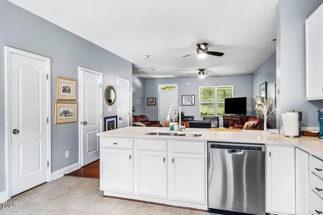 a bathroom with a sink mirror and toilet