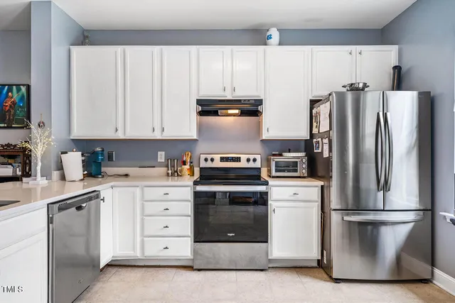 a view of a room that has a table and chair