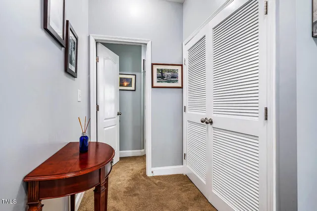 a bedroom with 2 bed chair and a window