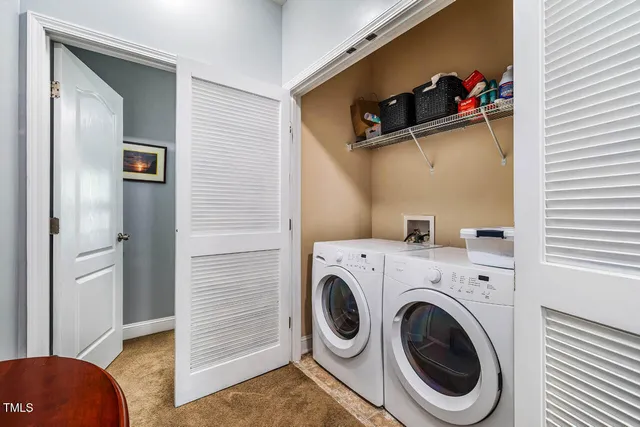 a bedroom with bed and chair