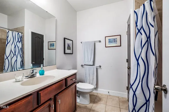 a bedroom with bed and tv