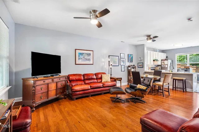 a view of a dining room with furniture and a flat screen tv