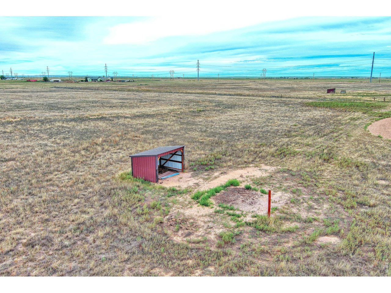 27 Co Road Carr, CO 80612 - Photo 7 of 17 One of two 10X12 metal loafing shed on the property.