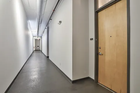 a view of a hallway with a white walls