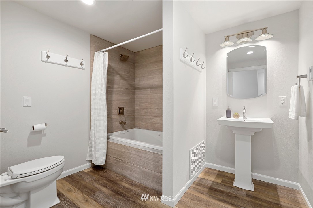 5431 Broadway Everett, WA 98203 - Photo 15 of 22 a bathroom with a sink toilet and shower