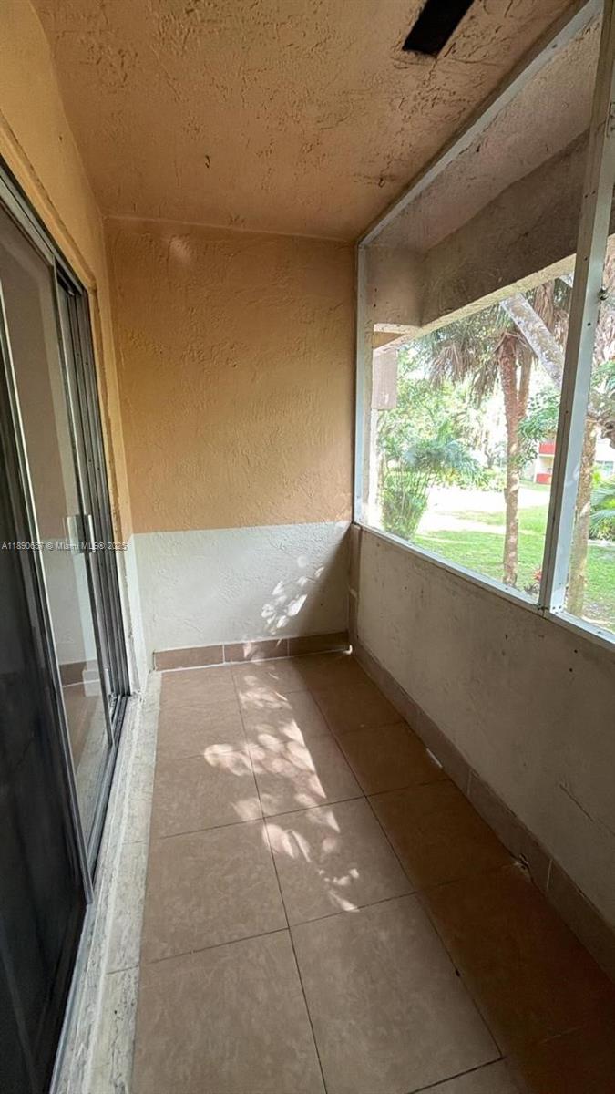 271 Bonnie Boulevard, Unit 205 Palm Springs, FL 33461 - Photo 12 of 12 a view of an empty room and a window