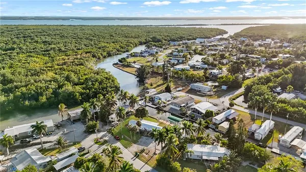 an aerial view of residential building and lake