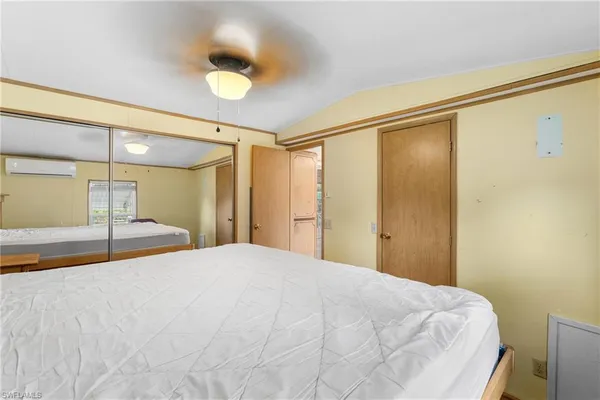 a large white bed in a white room