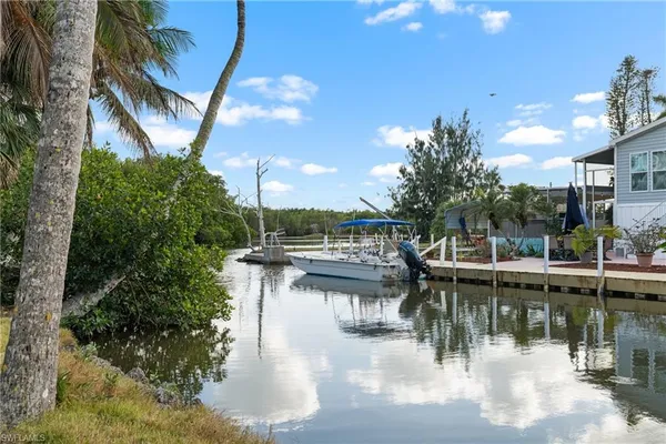 a view of a lake with a house in the background