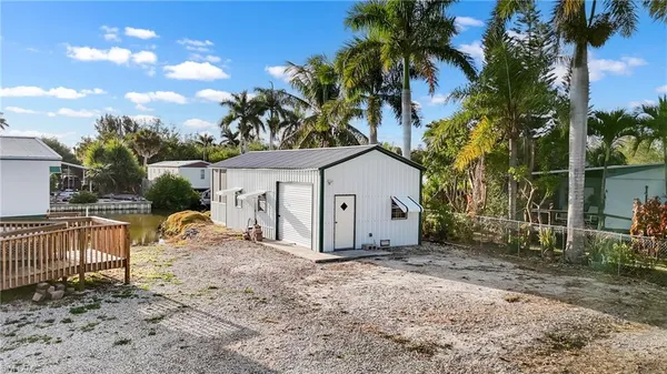 a view of a house with a backyard
