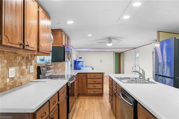 a kitchen with a sink and a refrigerator