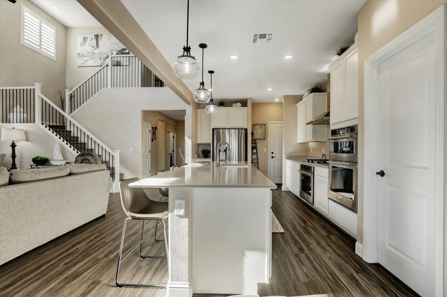 1104 Shadowgate Drive Roseville, CA 95747 - Photo 11 of 41 a view of kitchen with furniture and wooden floor