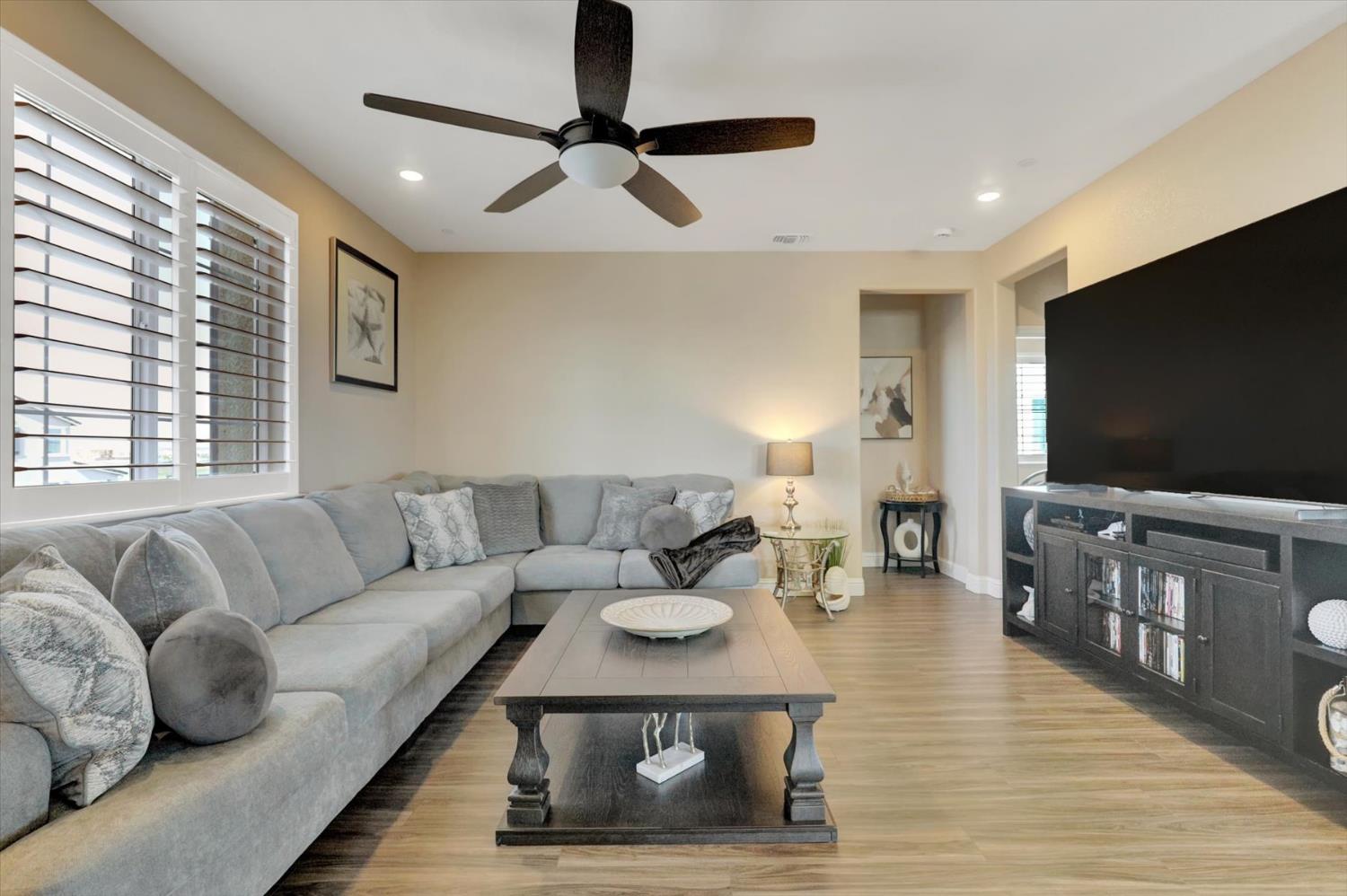 1104 Shadowgate Drive Roseville, CA 95747 - Photo 15 of 41 a living room with furniture and a flat screen tv