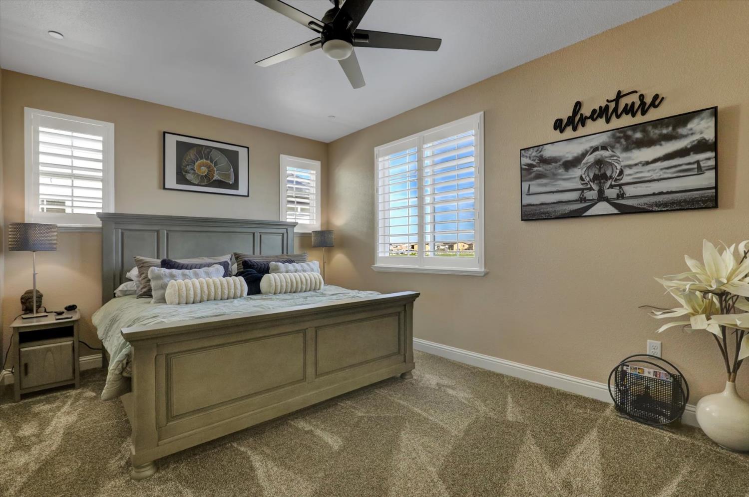 1104 Shadowgate Drive Roseville, CA 95747 - Photo 19 of 41 a bedroom with a bed and a painting on the wall