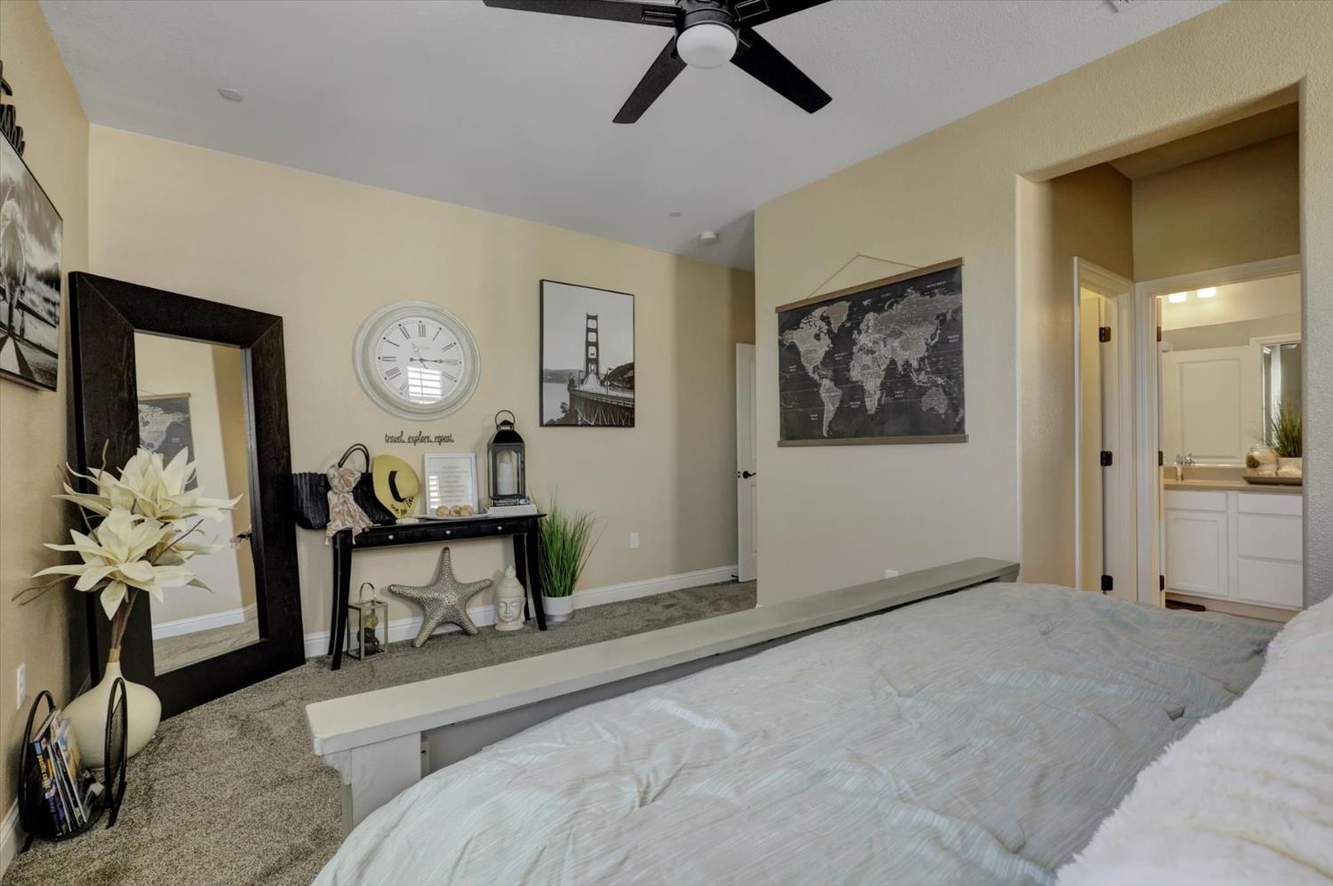 1104 Shadowgate Drive Roseville, CA 95747 - Photo 20 of 41 a living room with furniture a clock on wall and a window