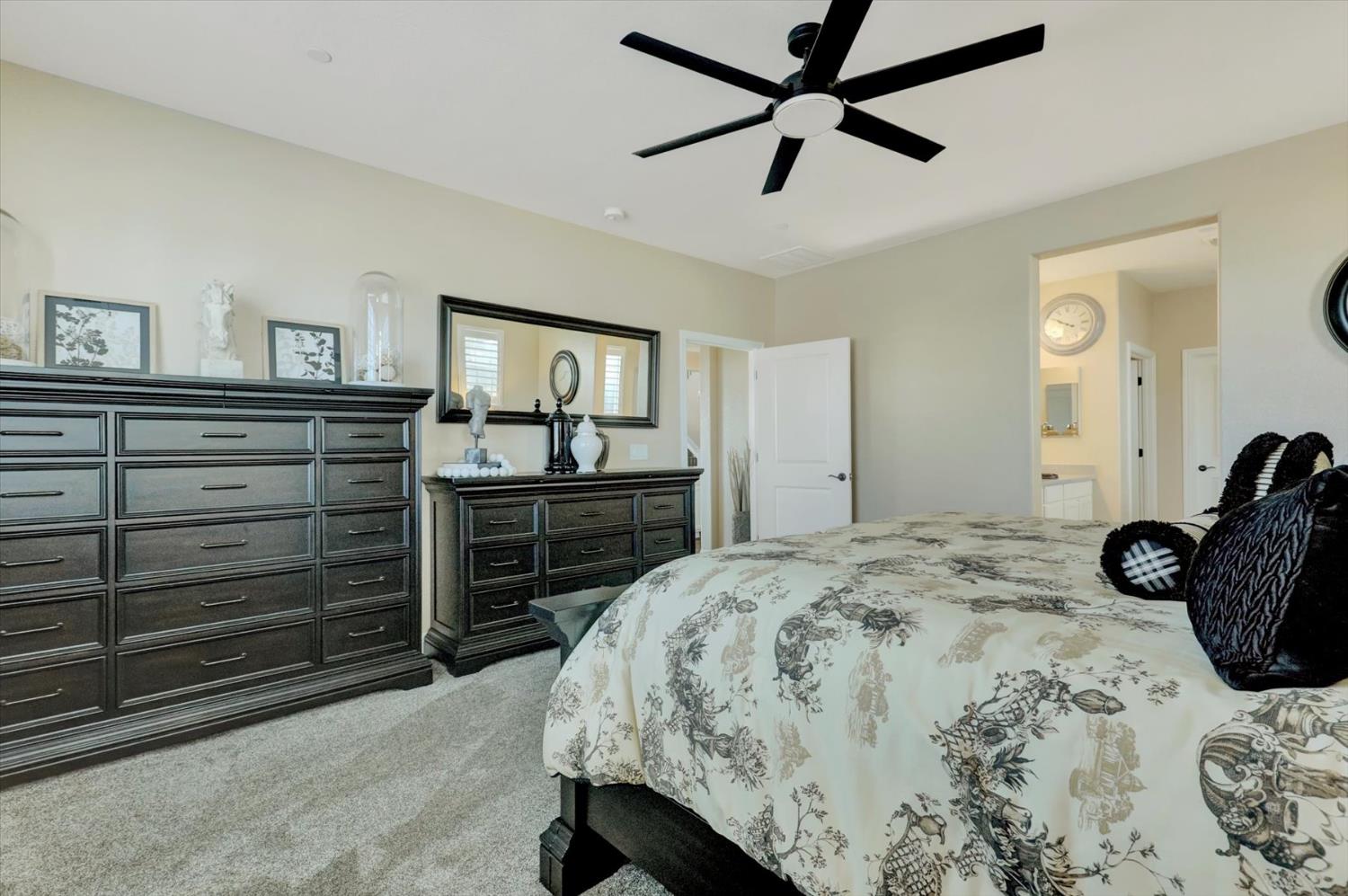 1104 Shadowgate Drive Roseville, CA 95747 - Photo 23 of 41 a bedroom with a bed and a dresser