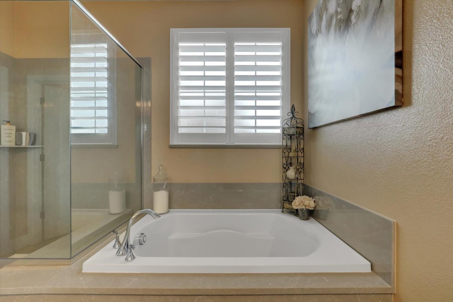 1104 Shadowgate Drive Roseville, CA 95747 - Photo 25 of 41 a bathroom with bathtub and window