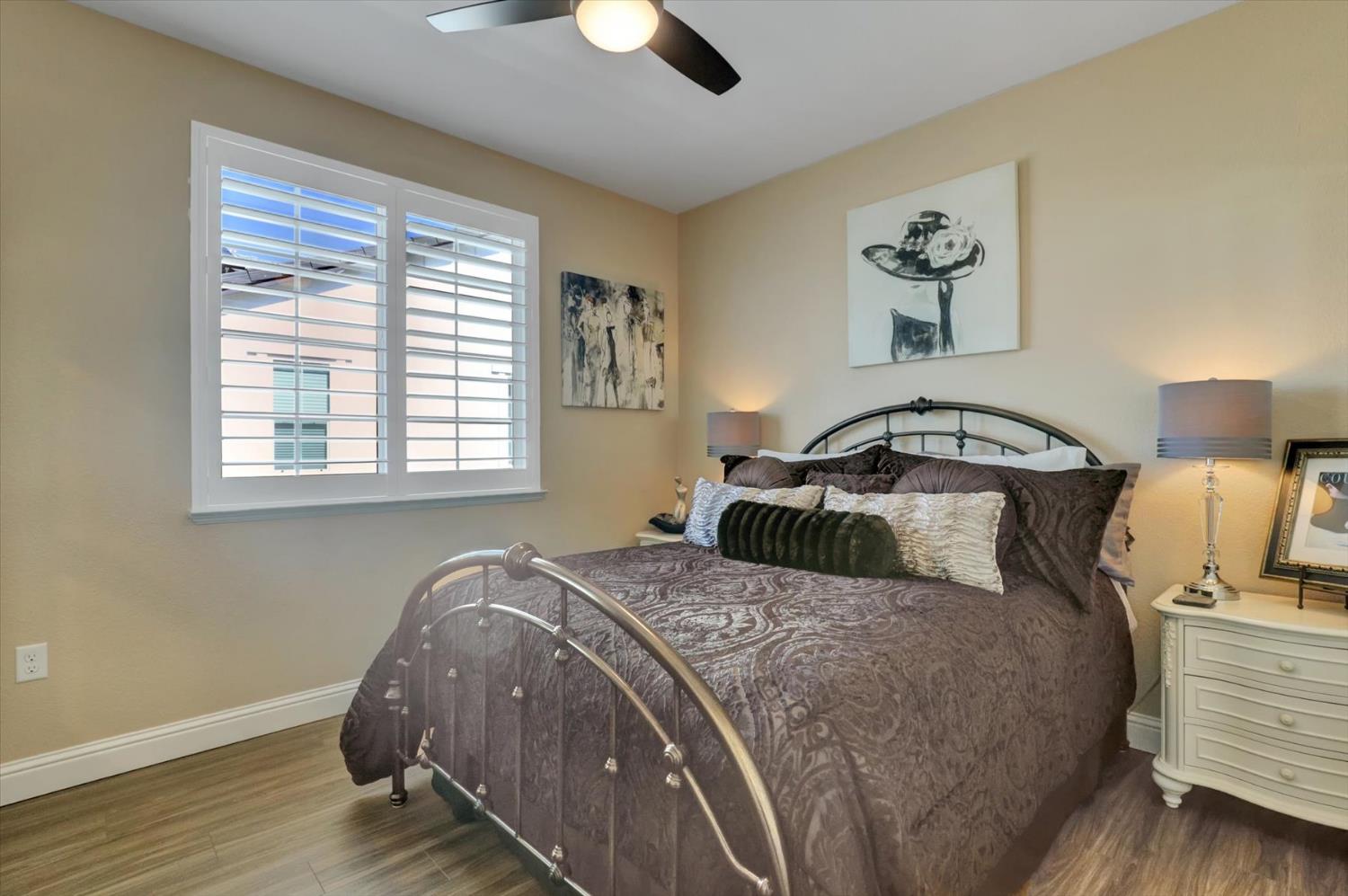 1104 Shadowgate Drive Roseville, CA 95747 - Photo 28 of 41 a bedroom with a bed and wooden floor