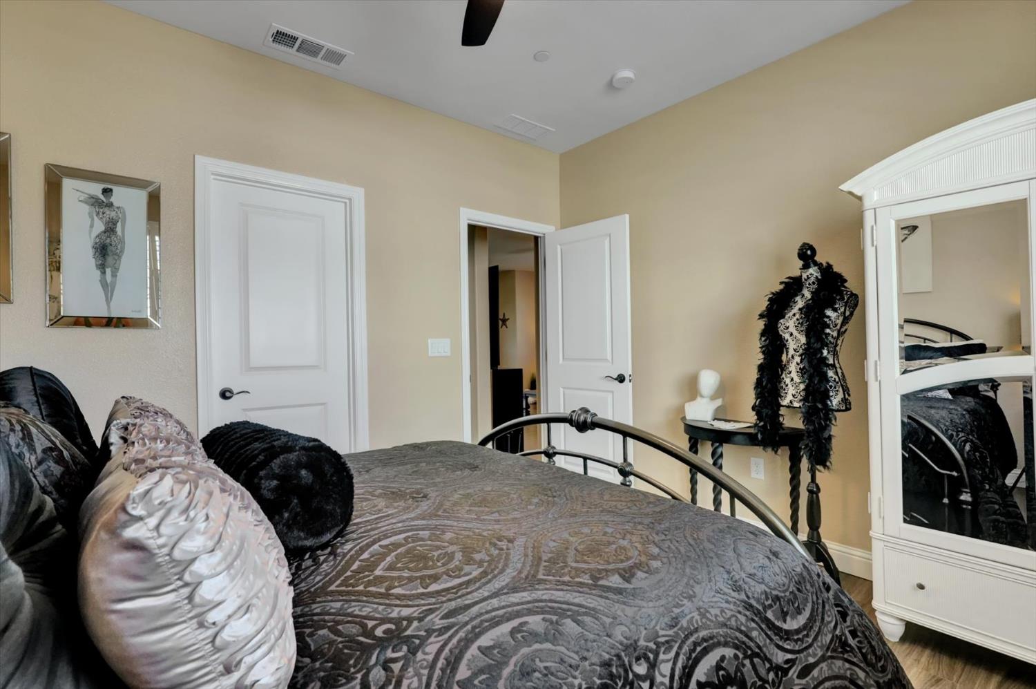 1104 Shadowgate Drive Roseville, CA 95747 - Photo 29 of 41 a bedroom with bed and a closet