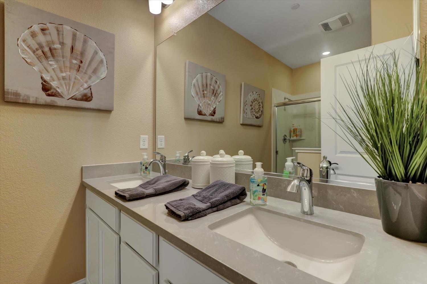 1104 Shadowgate Drive Roseville, CA 95747 - Photo 30 of 41 a bathroom with a sink and a mirror