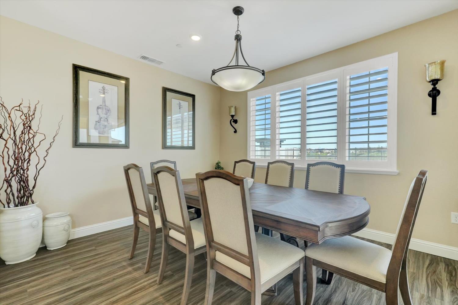 1104 Shadowgate Drive Roseville, CA 95747 - Photo 9 of 41 a view of a dining room with furniture window and wooden floor