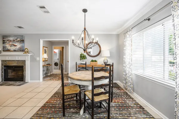 a dining room with furniture window and wooden floor