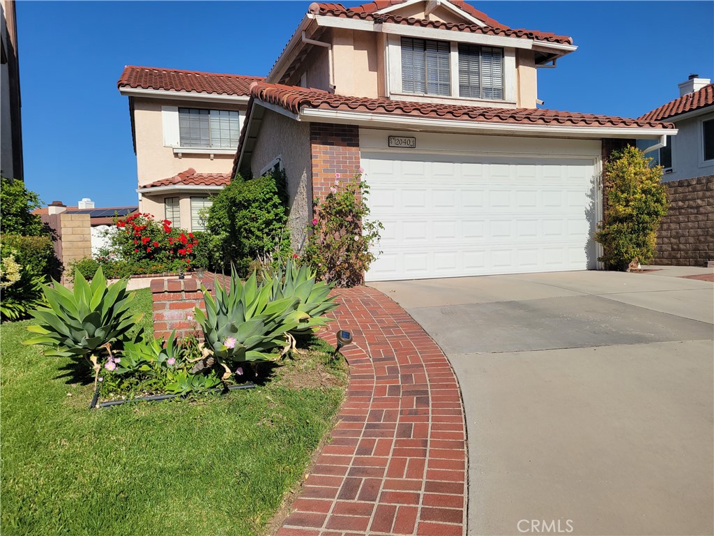 12040 Turtle Springs Lane Porter Ranch, CA 91326 - Photo 1 of 1 a front view of a house with a yard