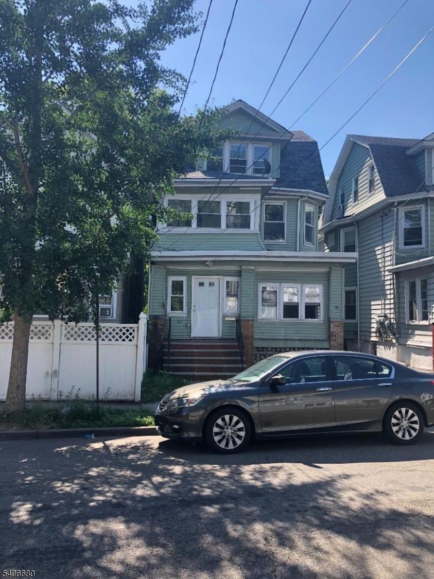 a car parked in front of a house