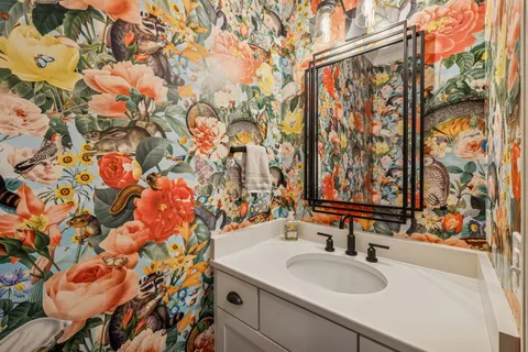 a bathroom with a sink toilet and shower curtain
