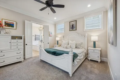 a spacious bedroom with a bed and a window