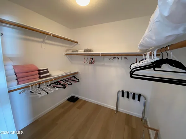 a view of storage and utility room with racks on the wall