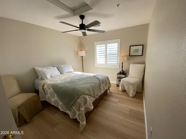 a bedroom with a bed and window