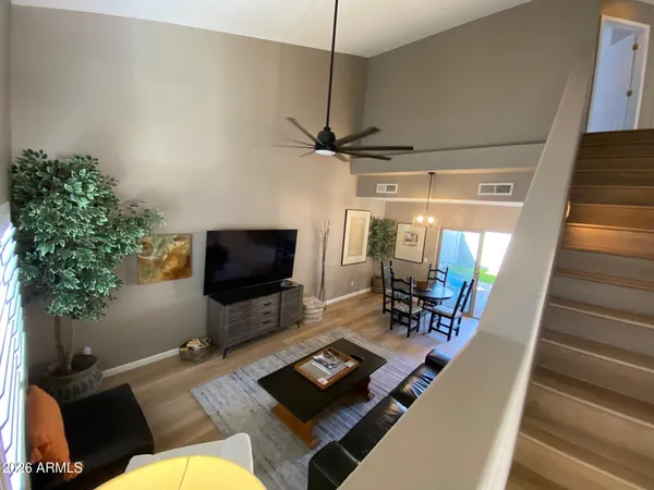 a living room with furniture and a flat screen tv