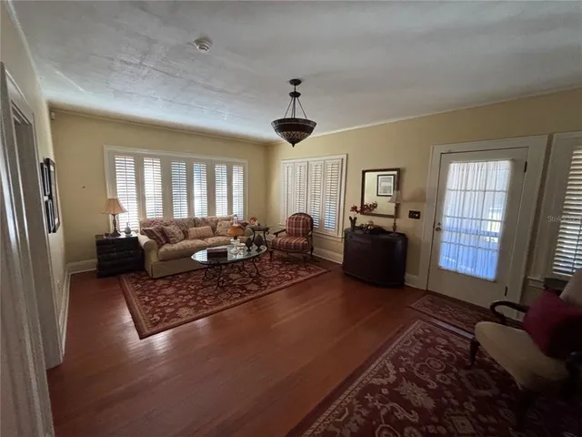 a living room with furniture rug and window