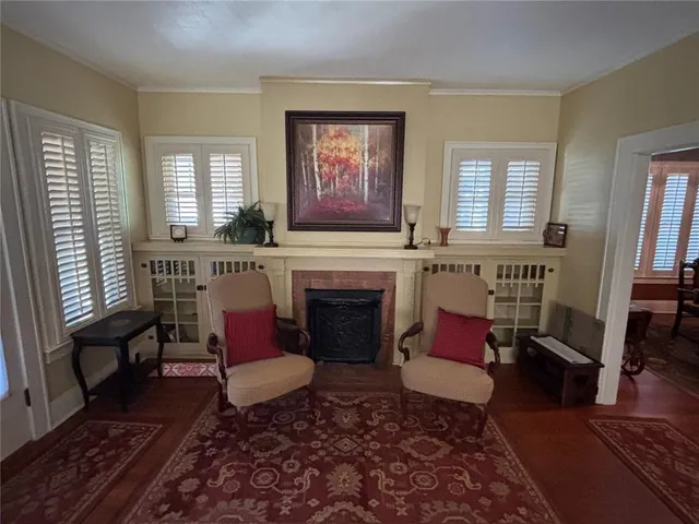 a living room with furniture and a fireplace
