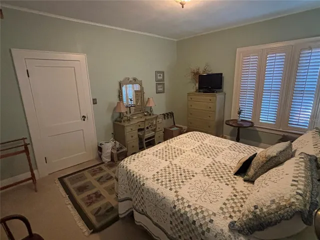 a bedroom with a bed and furniture