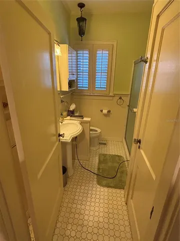 a bathroom with a sink a bathtub and shower