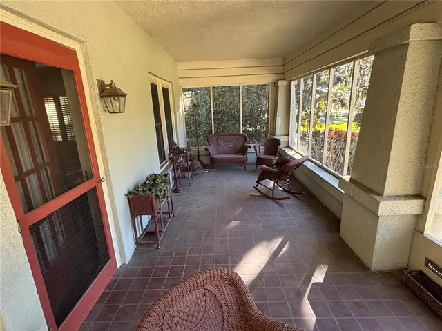 a room with furniture and a large window