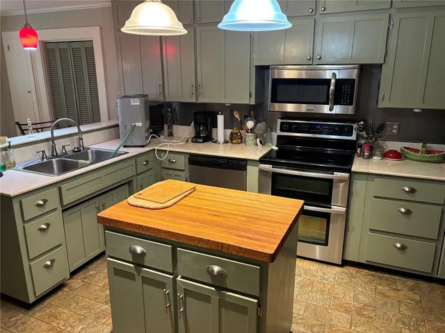 a kitchen with a stove and a microwave