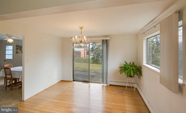 3619 Rusty Rock Road Randallstown, MD 21133 - Photo 11 of 30 a view of a room with window and wooden floor