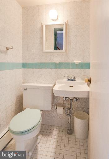 3619 Rusty Rock Road Randallstown, MD 21133 - Photo 13 of 30 a bathroom with a sink toilet and mirror