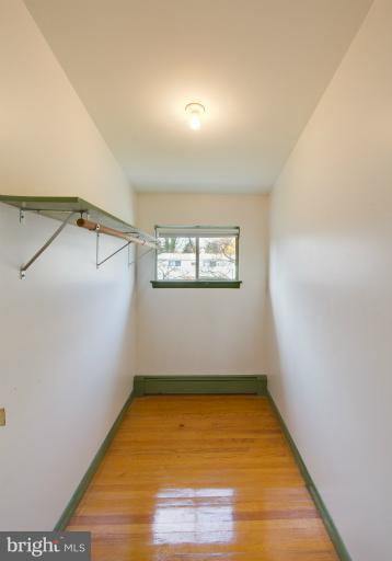 3619 Rusty Rock Road Randallstown, MD 21133 - Photo 16 of 30 a view of a room with wooden floor and white walls