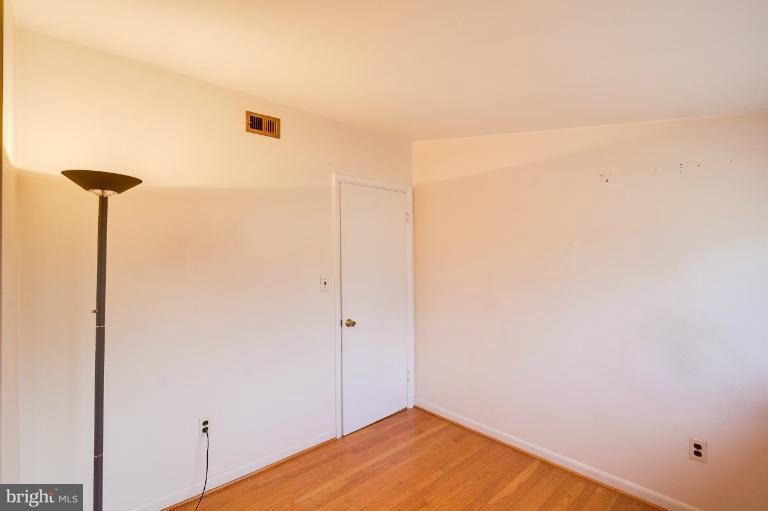3619 Rusty Rock Road Randallstown, MD 21133 - Photo 23 of 30 a view of a room with wooden floor