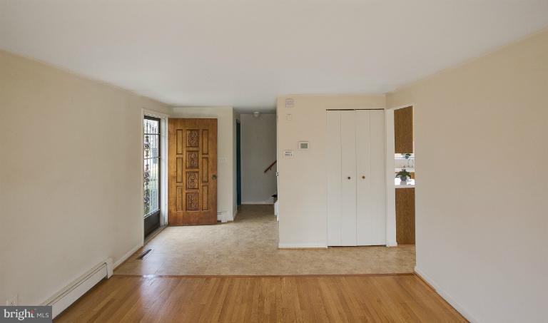 3619 Rusty Rock Road Randallstown, MD 21133 - Photo 5 of 30 a view of a room with wooden floor and white walls