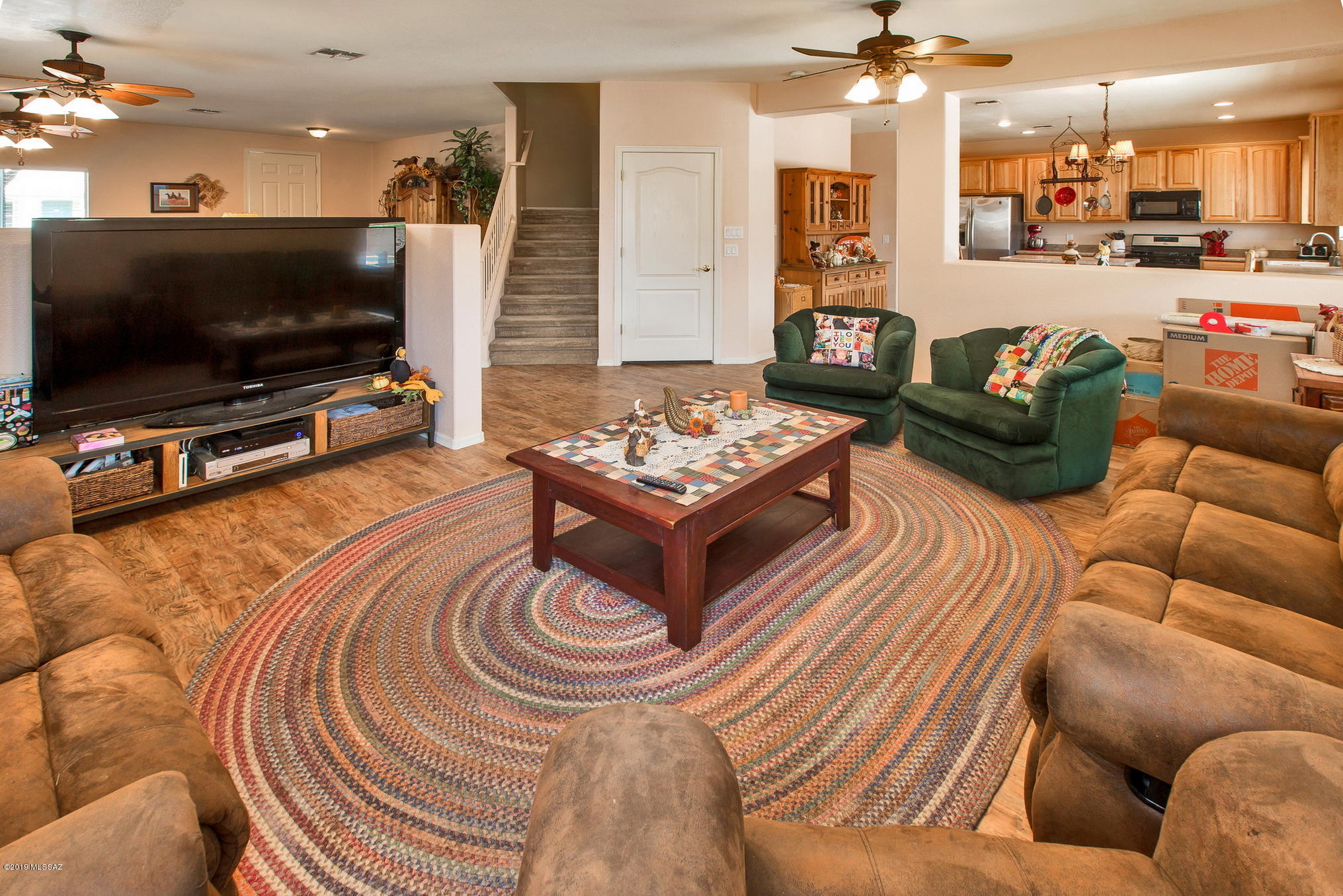 3600 East Mecate Road Tucson, AZ 85739 - Photo 10 of 39 a living room with furniture and a flat screen tv