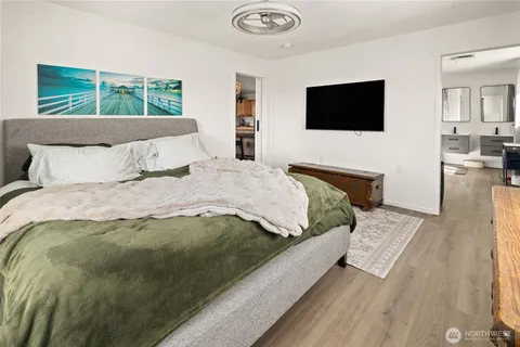 a bedroom with a bed and tv