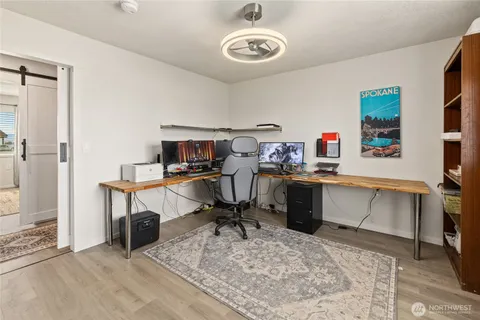 a view of a workspace with furniture