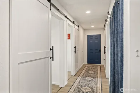 a bathroom with a shower and a glass door